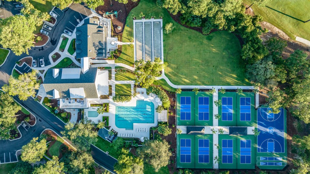 Colleton River Bluffton SC Real Estate Aerial view of Colleton River Club’s Sports & Wellness Complex, including pool and racket courts
